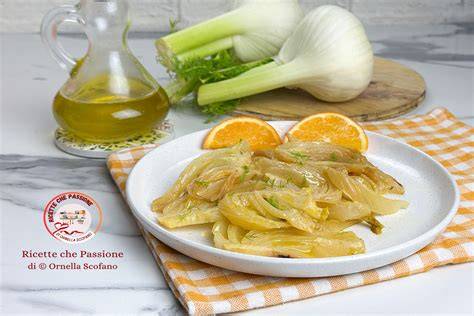 Maiale con finocchi e arance in padella